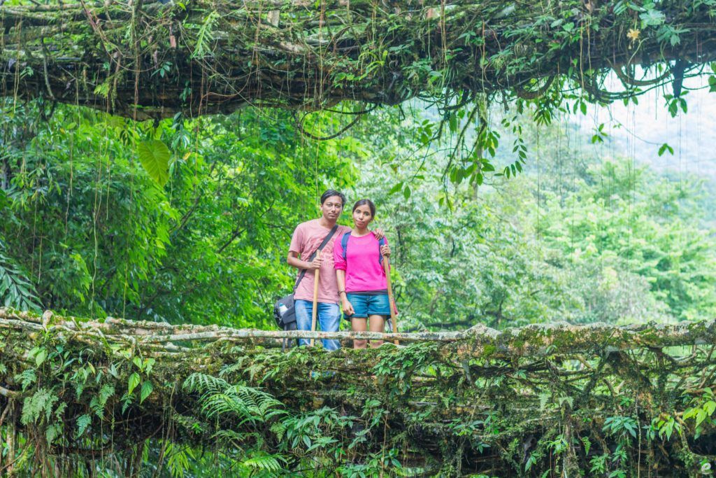 couple trekking double decker living root bridge meghalaya